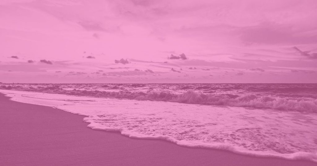 ocean waves meeting the shore at golden hour, symbolizing love and release