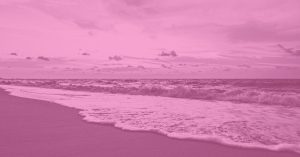 ocean waves meeting the shore at golden hour, symbolizing love and release