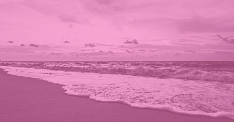 ocean waves meeting the shore at golden hour, symbolizing love and release